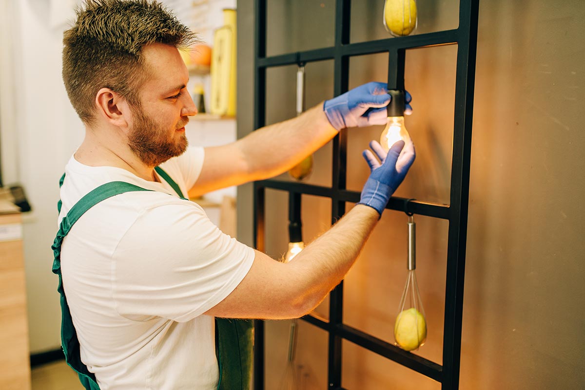 electrician-changes-the-light-bulb-handyman-resize.jpg electrician-changes-the-light-bulb-handyman-resize.jpg