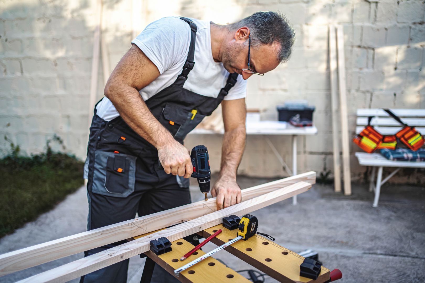 mature-male-carpenter-using-electric-drill-on-a-wo-2025-03-03-23-41-09-utc mature-male-carpenter-using-electric-drill-on-a-wo-2025-03-03-23-41-09-utc